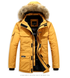 Detailed view of yellow men's parka with faux fur hood and multi-pocket functional design