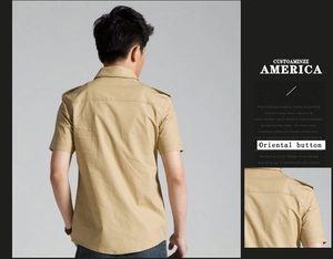 Macro view of khaki military shirt detailing back pleats and epaulets on shoulder