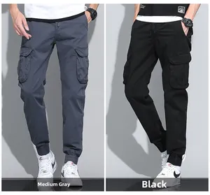 Detail view of cotton cargo joggers in charcoal grey and black with drawstring waist