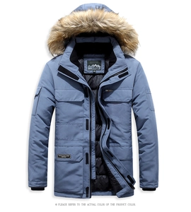 Detail of blue parkas hood with thick faux fur trim and multi-pocket workwear design