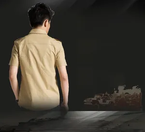 Detail of khaki military style slim fit cotton shirt featuring epaulettes and back seams