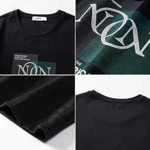 Detailed view of black cotton T-shirt featuring high-quality neck label and chest graphic