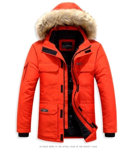 Close-up of bright orange men's hooded parka with thick faux fur collar and utility pockets