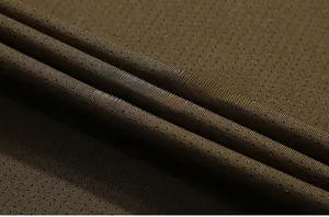 Macro shot of breathable quick-dry mesh fabric detail in army green for summer t-shirts