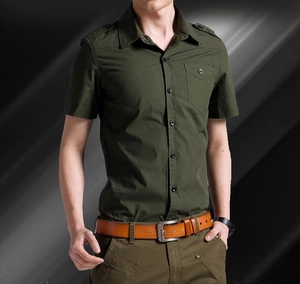 Detail of army green military style cotton shirt featuring shoulder straps and chest pocket