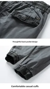 Detail of dark grey cargo pants featuring rear pockets and camo print on elastic cuffs