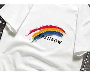 Detail of white cotton T-shirt featuring a colorful rainbow graphic and Rainbow text print