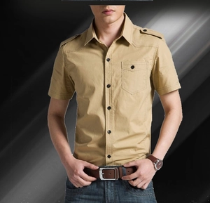 Detail of military style khaki shirt featuring shoulder epaulettes and classic chest pocket