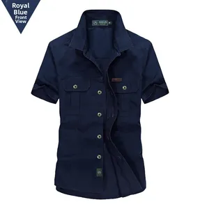 Detail of royal blue men's short sleeve shirt featuring chest pockets and metal buttons