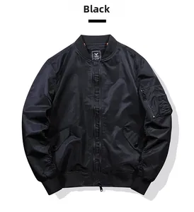 Flat lay of black MA1 bomber jacket featuring ribbed collar and functional sleeve pocket