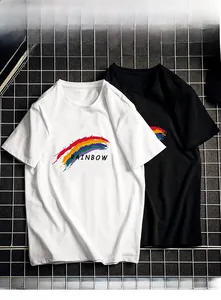 Close-up of black and white cotton t-shirts with vibrant rainbow print on metal grid