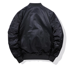 Back view of a black MA-1 bomber jacket featuring glossy fabric and ribbed knit trims