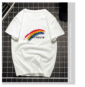Detailed close-up of white cotton T-shirt featuring rainbow print and text on metal mesh