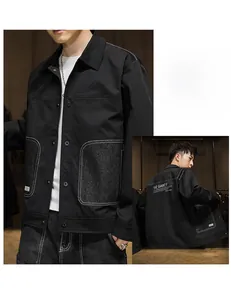 Detail view of men's utility jacket featuring contrast pockets and THE GAME back print
