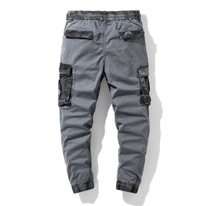Loose dark gray cargo pants with multi-pocket design and drawstring cuffs for men