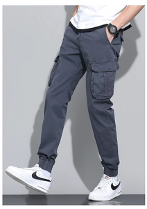 Close-up of men's cargo jogger pants with side flap pocket and elastic drawstring waist