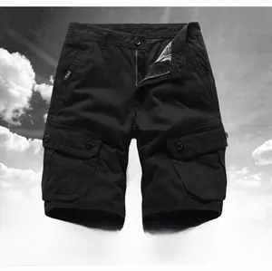 Detailed view of black multi-pocket cargo shorts with button-flap utility pockets