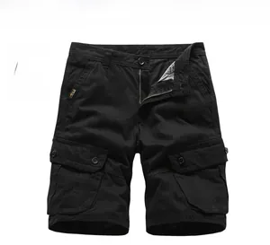 Detailed view of black cargo shorts with large flap pockets and durable twill fabric