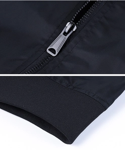 Detail of metal zipper and ribbed cuffs on black MA1 flight jacket for men