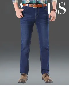Detailed shot of men's dark blue straight jeans featuring yellow contrast stitching and stretch