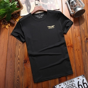 Army style loose cotton t-shirt in black featuring gold wing star logo on wooden hanger