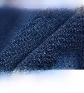 Detailed macro view of high-density woven long-staple cotton denim fabric for men pants