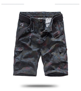 Detail of cargo shorts showing camo pattern, flap pockets and black woven belt