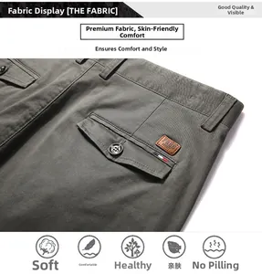 Detail of men's casual pants showing the fabric texture and brown leather logo patch