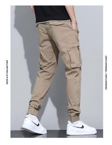 Detailed view of cargo pants featuring utility side pockets and tapered elastic cuffs