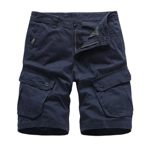 Navy blue men's cargo shorts in twill cotton with side flap pockets on white background