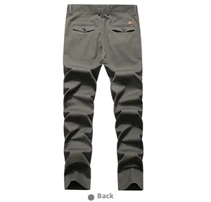 Detail view of the back pockets and brown leather patch on men's straight casual trousers