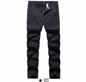Detailed close-up of dark blue men casual pants with metal zipper and belt loops