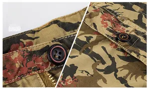 Detail of cargo shorts waist closure featuring durable twill fabric and camouflage print