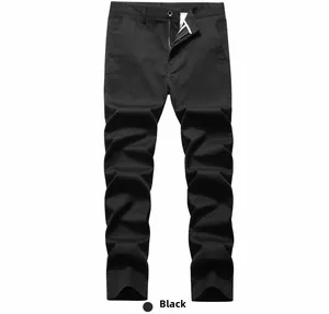 Detail view of black casual trousers featuring a metal button and zipper fly closure