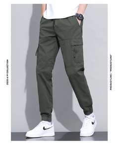 Detail of army green cargo pants featuring side flap pockets and ribbed cuffs