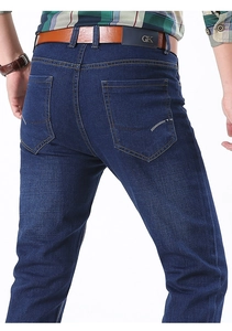Detailed back view of men's dark blue stretch jeans with classic five-pocket design and belt