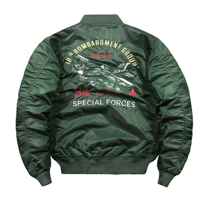 Detailed embroidery on the back of a classic military-style army green bomber jacket