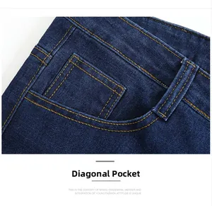 Detail of deep blue jeans showing slant pockets and contrast orange topstitching