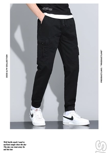 Detail of men's black cargo joggers with large utility pockets and drawstring waist