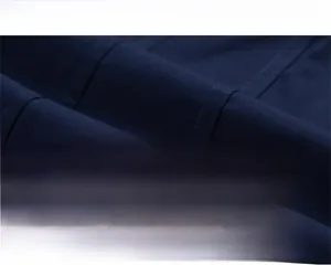 Detailed macro view of deep blue premium cotton fabric showing soft texture and fine weave