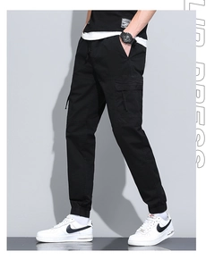 Detail view of men's cargo joggers featuring side utility pockets and ribbed ankle cuffs