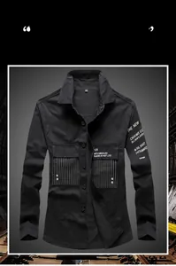 Detail of black cargo shirt chest pockets with white stripe and graphic text print