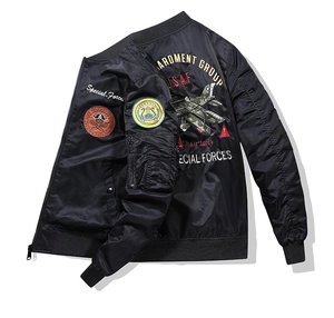 Flat lay of black bomber jacket with USAF embroidery and detailed flight back patch