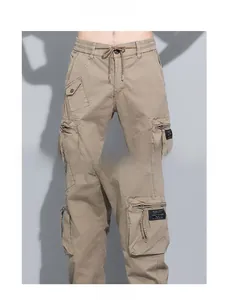Detailed view of khaki cargo pants featuring elastic drawstring waist and flap pockets