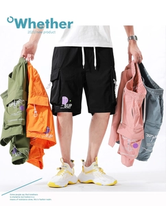 Detail of multi-pocket cargo shorts in five colors featuring side pockets and drawstrings