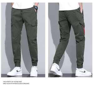 Detail of olive green cargo jogger with elastic drawstring waist and side flap pockets