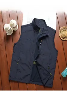 Detail of navy blue outdoor vest featuring zippered pockets and breathable mesh lining
