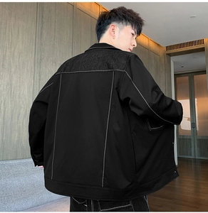 Detailed back view of vintage-style patchwork jacket with contrast white stitching