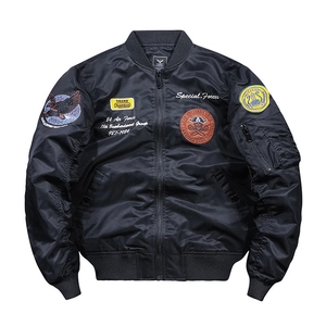 Men's MA1 black bomber jacket featuring military embroidery patches and baseball collar