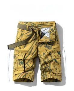 Detailed view of yellow camouflage cargo shorts with multi-pockets and olive woven belt